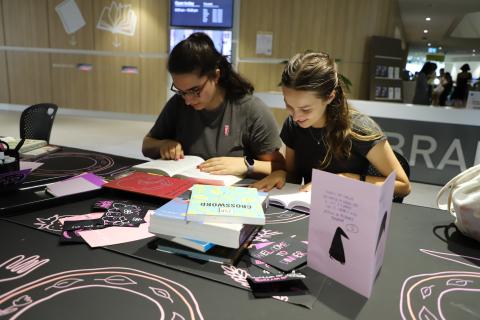 Students reading books at THE BIBLIOMANCY FEAST